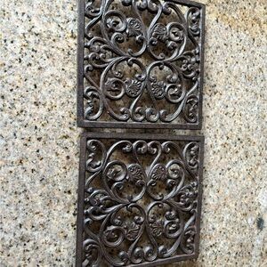 Iron trivets (2) one is missing the bottom plastic